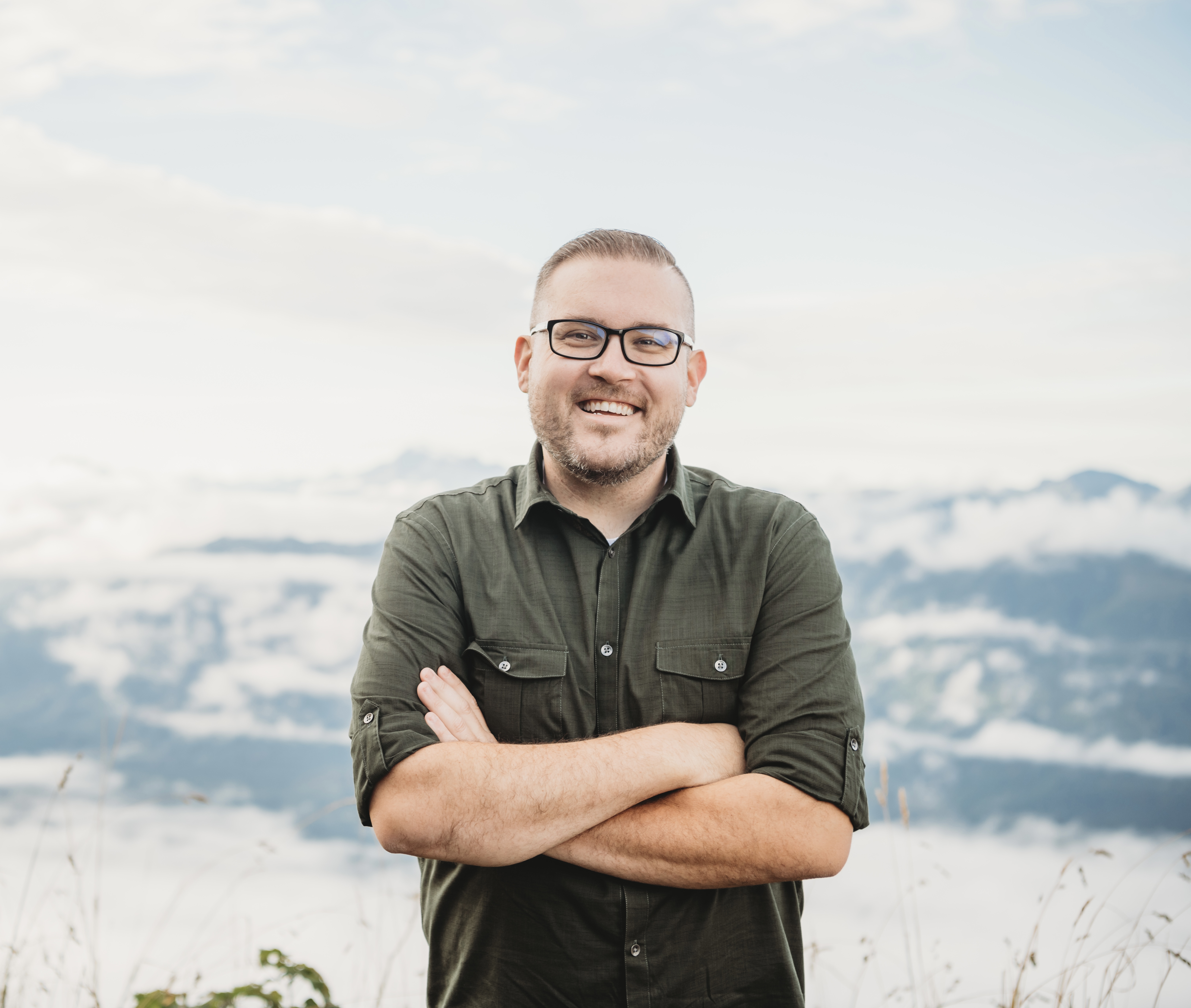 Jon on a hike, looking out over a valley
